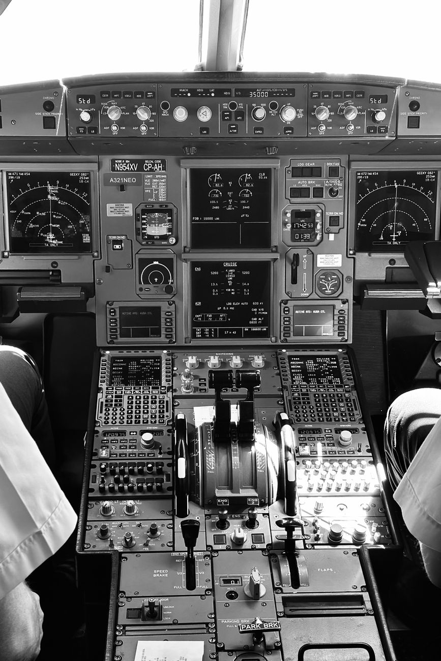 Black-and-white view of an aircraft control panel